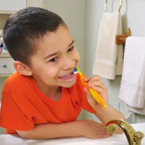 kid brushing his teeth