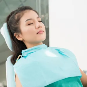 relaxed patient in dental chair